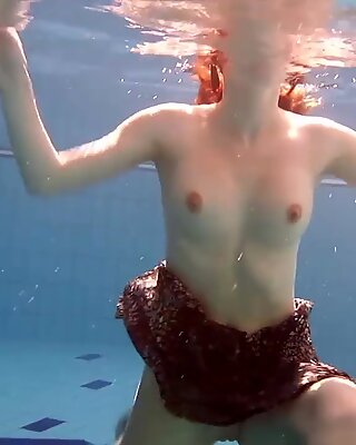 Big tits brunette Mia underwater naked