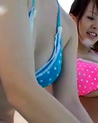 Funky and really busty Japanese girl Hitomi Tanaka has fun with her girlfriend