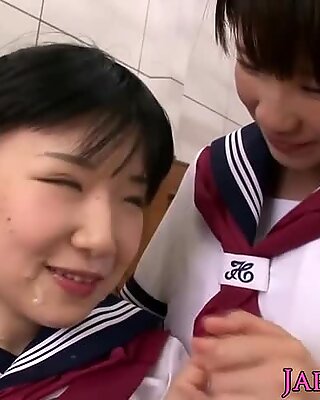 Naughty young Japanese schoolgirls sharing penis